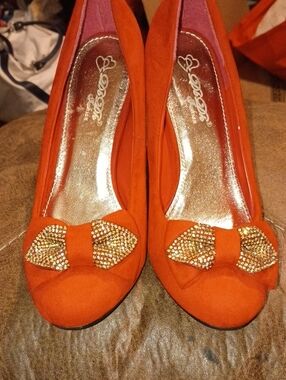 Guess Orange Bow Flats with Gold Crystal Accents